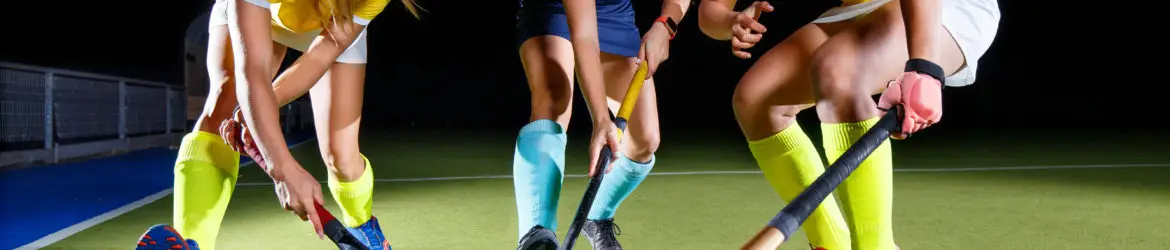 Field hockey female players struggle for the ball