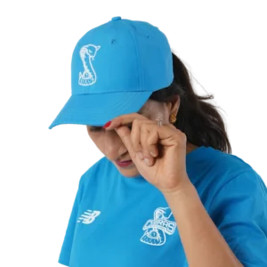 Melbourne Cobras player wearing a blue Cobras cap and shirt